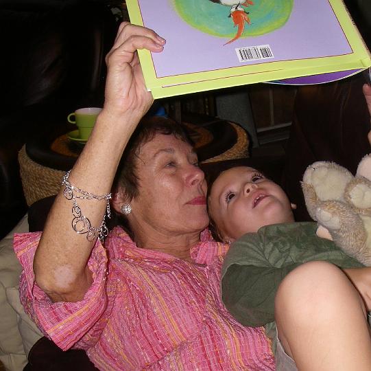 IMGP5452.JPG - Mom and Sammy reading together again. Mom laughs at this book - the words are so crazy. Sammy is learning Hawaiian and Spanish, and some Spanglish. Such a multilingual kid :)