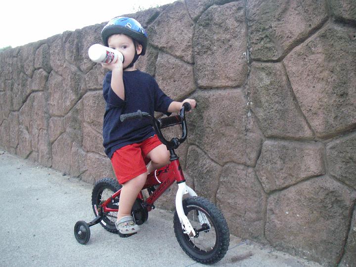 IMGP5461.JPG - Mountain biking along the marsh trail. Sammy is quite fast on his bike. We have to jog to keep up!