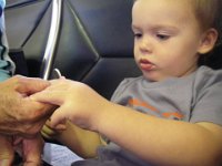 IMGP0472  Filing Gramma's nails while waiting to board.