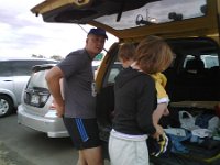 dressing the coach on site  Getting Sammy dressed in his race clothes. He got right out of bed and into the truck, still wearing jammies :) It was early...we left at 5:45am.