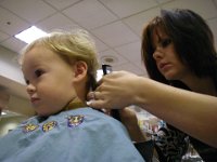IMGP3872  That's Laura - she cut my hair, too. She did a really nice job. The salon is on the Marine Corps base - $23 for both of us, total. Amazing, huh?