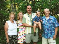 Family at luau  A luau with Dad and Marilou at the Hale Koa. It was a lot of fun and well worth the visit. Sammy enjoyed dancing during the displays of traditional island dances after dinner. He had a blast! This photo is now framed and hangs in Sammy's room next to the one of him with Nana and Pop Pop at the Dole Plantation train ride. He says goodnight every night and prays for all his grandparents each night at dinner. ("Bess Nana and Pop Pop at Ew York, Bess Grammie and Grandpa in Ew Jersey, Bess Gramma at Washington...")