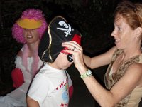 2007-10-31HawaiianHallowe'en (18)  My friend Dana in the background in her outfit - supposed to be a baby flamingo, but her costume is rather open to interpretation. She made me a wonderful kangaroo outfit from clothes she found at Goodwill. I even have a tail!!! And ears!