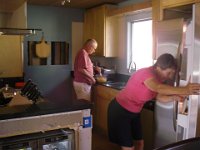 IMGP5797  Mom and Pete making eggs for breakfast - first breakfast in the new kitchen! It's maybe 80% done here. All appliances and water-fed things are functional. Still doing some trimwork and brick needs to go on the walls.