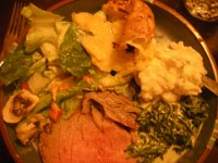 IMGP5974  Salad, Yorkshire pudding, garlic mashed potatoes with thyme and rosemary from the garden, creamed spinach, and standing rib roast. Dave also made horseradish sauce but we forgot to pull it out of the fridge!