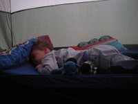 IMGP6304  Sleepy buddy waking up in the morning. He had a cold but was a trooper about sleeping even though he had a lot of coughs. Mommy didn't sleep so well listening to the rustling, coughing, squirming, repositioning... Oh well! The joy of camping wasn't the least dampened. It rained at one point just after he went to bed and when I went in to close the windows he said "who's out there?"