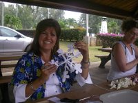 IMGP6814  We ran into some ladies learning to make leis. This is Harriet with her beautiful paper cutout. Kathy and I made mental notes so we can be crafty sometime :)