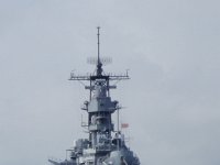 PC100086  The USS Missouri bears watch over the USS Arizona. Her bow is not pointed out of the harbor as all other moored ships would, but pointed toward the Arizona.