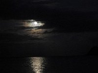 2009-01-10MoonriseOverMokesRichardResized (24)  Moonrise over the Mokes - moon is at perigee, so closest to the earth. It was very big and bright! We had a nice time playing in the water - just me and the boys. Everyone else scooted home soon after sunset. We romped by moonlight, and Ben crawled straight for the water, just like a baby honu hatchling!