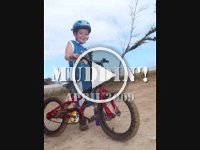 2009-04 Muddin on mtn bike  Here's video of the fun. I can't believe Sam has only been riding his bike without training wheels for a month!