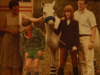 P4060003  My friend Angel is hosting her own 40th birthday sleepover, and wanted a picture of me in junior high. I think I'm about 13 here. Maybe 12. I'm not sure...this is my beloved pony, Soda. He'd just made a mockery of me at a horse show by sinking his chompers into a huge decorative pine in front of a jump he was supposed to have gone OVER, but decided to eat instead.