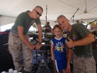 P4110022  We stumbled across a Marine Corps Band concert, and Sam was invited to play the big guy drums! What a hit! (We're wiling the day away while Dave goes into work and we cool our heels waiting for a space-a flight.)