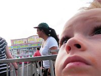 P8160006  Looking up at the ferris wheel, waiting for our turn. "Wow, that goes pretty high, huh?"