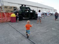 P8160064  Running to the Humvee. Smart Sam is telling me - "Hey mom, this trash can isn't for trash!" I was really impressed he made note of that before throwing the cotton candy tube in. Very good.