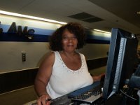 P9240001  In the terminal marking ourselves "present" so we can be counted for roll call. This is a wonderful lady who helps me whenever we pass through!