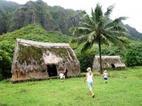 PA120043  to the village! Apparently the women would live in the one on the left and the men on the right. They would cook out in the open area, fishing in the stream and gathering fruit from the guava, papaya, and coconut trees.