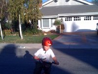 ATT00045  Sam is so serious practicing his biking. Look at the face!