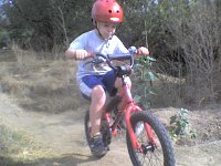 ATT00427  More biking on his new bike! Such fun on these trails! Gramma even got on a bike to tool down with Richard and Sam.
