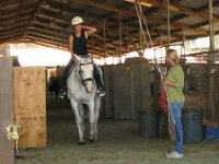 IMG 0414  Getting a horseback riding lesson in an English saddle! So exciting! I didn't know it but my helmet was askew the whole time - no laughing! It was just a little big. My mount is Leah - she is ranked 8th in the country among paralympic equestrian shows.