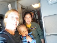 PB120005  We are up in the cockpit at the invitation of crew member Glenda (pictured). She was so awesome! I'm holding Ben while Sam flies the plane!!!!