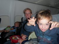 PB120014  Almost there - maybe an hour to go? Ben slept 1 hour out of 6 1/2! Oy! Sam slept none. Mommy slept none. AND it was bumpy! But the flight crew were awesome...really amazing. Based out of Jacksonville, their name is the "Sunseekers" and funny enough the commander's last name is Striker, like the guy on "Airplane". He said, when we landed, "Thank you for choosing Sunseeker, we hope you fly with us again."