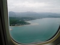 PB120026  Flying into Kaneohe Bay this time - the Marine Corps Base near our home. We couldn't see anything until we got below about 2000 feet - very cloudy. So fun to see our side of the island by air, and to land on the airstrip we always cross to get to Hale Koa beach.