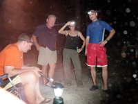 P1010107  This is how you relax while camping out in Hawaii where centipedes reign supreme at night. See headlamps? Dave's weapon? Jon's weapon? (A crow bar, which also did a nice job on cutting the beetle's carapace on the cake!) Dave is not a big centipede fan, so he was very brave. A few millipedes gave him a little opportunity to test his reflexes :) Our tents zip up tight so we are fine at night, you just get a little creeped out, especially if your mother-in-law leaves your tent unzipped after tossing your pillow in there!!!