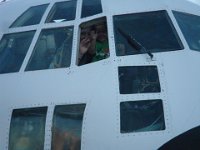 IMGP0777  Mom and Ben up in a C-130, waving. Ben had been sick the night before, but we are thinking we're fine at this point - over it. Little did we know...