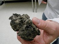 IMGP2606  This is a piece of rock collected last Tues. It is technically called "scoria," meaning "blown out." If you want to be even more precise, call it basaltic (basalt rock) scoria lapilli ("lapilli" meaning small size, about 2mm to 10cm).