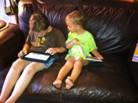 2011-04-24EasterKrugKailua (2)  Reading while watching Sam play Angry Birds on Richard's ipad. Ben is SO good about just looking.
