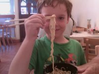 IMAG0330  Now...for an eating adventure. We went to a local ramen place to try it out. Never had ramen before. Very tasty! But hard to manage for boys until they get the hang of it. Here Sam is demonstrating very good technique! (Having ramen in honor of Daddy who is still in Japan at this point.)