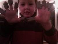IMAG1257  Ben is becoming a robot - he thinks these are his robot fingers. He had a good time - mixing it right up with all those boys. He played with the younger sibling of one of the boys - a little girl - and seemed to have a nice time.