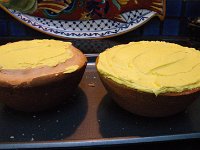 IMGP5937  Two spheres being sealed together to create a sun. This is attempt #2 at a sphere cake. I got good advice at the market - Town and Country - use pound cake. Indeed. It worked.