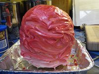 IMGP5947  This was the first attempt. An oblate spheroid, not quite spherical, and made from Rice Krispy treats in a mold. Very hard to do, but very very solid cake. If you want to put candles in it, you have to use a drill. Seriously. Good for structural elements in a cake, but not as edible...as you will find out later.