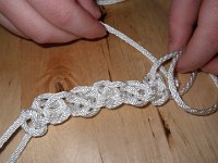 IMGP6002  Sam tying a double carrick bend sennet bracelet for his teacher.