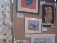 IMAG1424  Sam's artwork displayed at a competition - the two Spirographs at the bottom left. One is a collage. He was bummed he didn't win anything, but it was a good experience to talk about it. No one knows how many hours and hours went into those Spirographs!