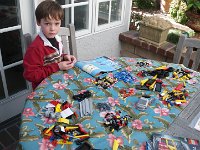 IMGP6133  Sam is building a flat bed truck now - a new Lego Technic to keep him company outside on the lanai.