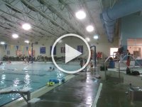 VIDEO0074  Ben loves to jump in like this and tries to land on his instructor's head - not intentionally, just trying to jump out really far! He loves to swim and spends a lot of time under water while waiting his turn to swim to the instructor. He doesn't like back float much - he's stiff as a board and L-shaped - like a pop-up toaster. The legs go up when the head goes back, and the head goes up if the legs go down!
