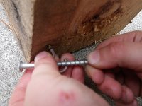 IMGP7543  Ben is learning about leverage, using a long screw to twist an eye hook into place.