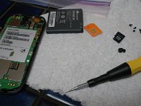 IMGP7816  One of the irons in my fire. Determined to fix my own smarthphone digitizer (face plate) which I have a habit of cracking. I got it all torn apart only to find I really need a heat gun to get the adhesive off the mounting so I can get the face plate off. This motherboard came out - little ribbon cables and all.