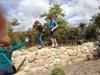 2013-04-01 (79)  At a nearby playground. They always need to be climbing on rocks and walls. Everywhere they are on walls!