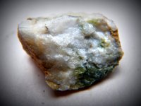 IMGP9840  A quartz with green in it - maybe more olivine or peridotite?
