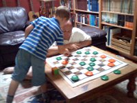 Pic-08252013-002  School dad in checkers! Ben is pretty good, actually!