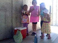 Pic-08302013-001  And here we are hosting a new student social - these are my helpers delivering freeze pops to the new kids so they feel welcomed and have a few friendly faces to look for this week when they start school.