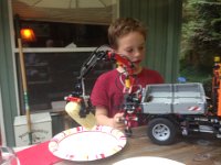 Unimog at dinner  Unimog putting corn on the plate.