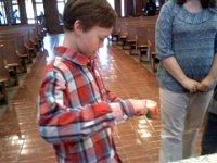 Pic-02092013-003  Lighting a candle after talking to the priest and saying prayers together. It is a beautiful rite of passage marking a young man's faith development. The church is doing a wonderful job.