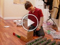 IMGP8244  A domino cube, and Sam talking about building. He keeps all his 1000 dominoes sorted into drawers by color. Often, we all help pick up - it's good bonding time.