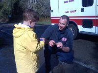 Pic-03202013-002  Randomly stopped by an ambulance crew while on our walk to be given a sticker. Ben is so funny - he said he wasn't interested in a sticker! I said - hey, I'll take it! :)