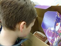 Sam's 9th flag football party 001  Peeking at the cake - I have three very excited boys with me at the market picking it up. : Sam's 9th flag football party