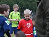 Sam's 9th flag football party 035  Ian is another neighbor and friend, in light green. He's a big swimmer, but came out to support us. So nice! He's in 5th, too. : Sam's 9th flag football party